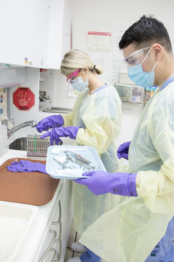 Dental Assisting students work in class.